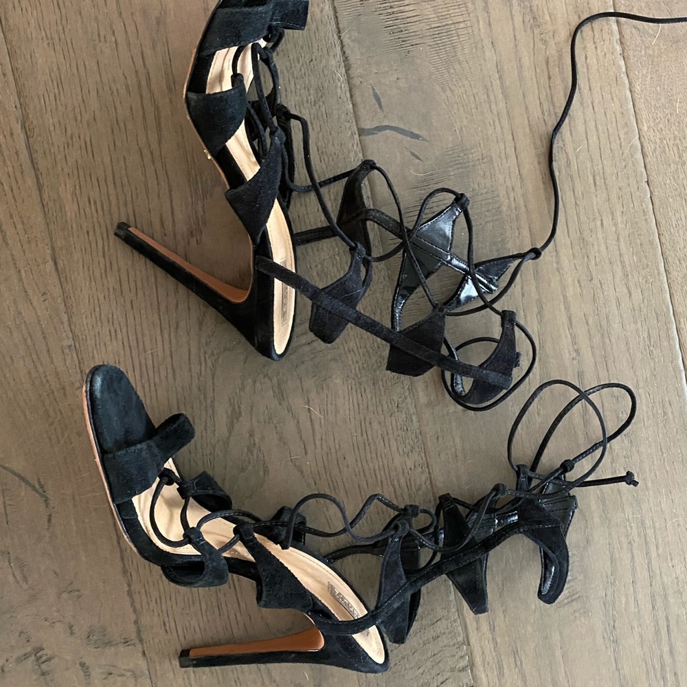 Schutz black strappy high heel.